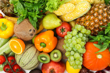 Different fresh fruits and vegetables as background, top view