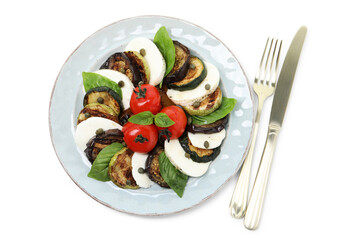 Tasty salad with grilled vegetables, mozzarella cheese and cutlery isolated on white, top view