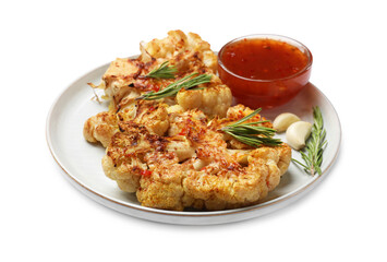 Delicious baked cauliflower steaks with sauce isolated on white