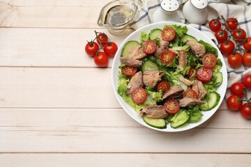Delicious fresh tuna salad on white wooden table, flat lay. Space for text