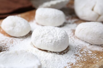 Dough for tasty homemade mochi on wooden table, closeup