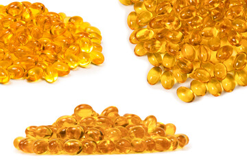 A group of yellow capsules isolated on a white background.
