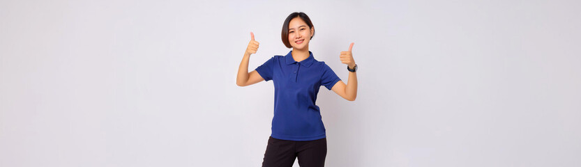 A portrait of a Southeast Asian woman wearing a navy polo shirt and giving a thumbs up.