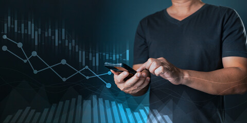 man use smartphone graphs and progress of business and analyze financial,and investment.Use technology to plan strategy to success goals and growth stock.online business,e-commerce,online marketing.