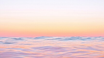 Obraz premium A serene ocean view at sunset, featuring soft pastel colors and gentle waves, creating a tranquil and calming atmosphere.