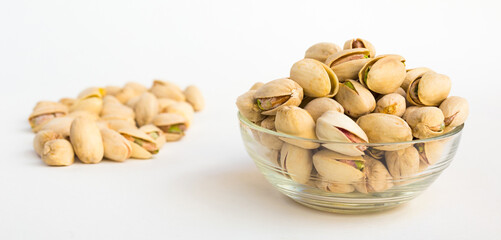 Roasted pistachios on white background