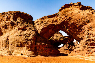 Double natural arches. Unusual rock formation. Wadi Bouhadian,  Tadrart mountains, Tassili N'Ajjer National Park, Algeria, Africa