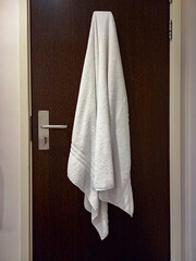 White towel on a bathroom door