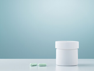 clean and minimalistic image of white pill bottle with green capsules beside it, set against soft blue background, evokes sense of health and wellness