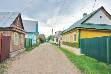 Obraz premium View of wooden houses in the town of Raków in Belarus, formerly Polish territory