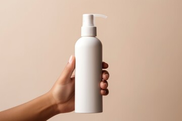 Spray bottle holding hand cosmetics.
