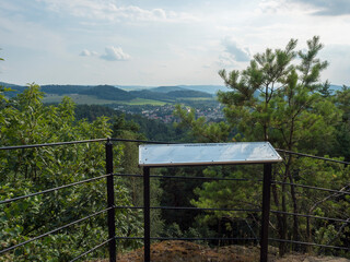Fototapeta premium Panoramic view from sandstone rock viewpoint Ponorka, submarine at the top of 3 sandstone towers near Ceska Kamenice town. Summer landscape in Lusatian Mountains, green hills,oak and pine tree forest.
