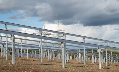 Obraz premium Construction site for solar panel system, transformation to renewable sustainable energy, environmental conversation