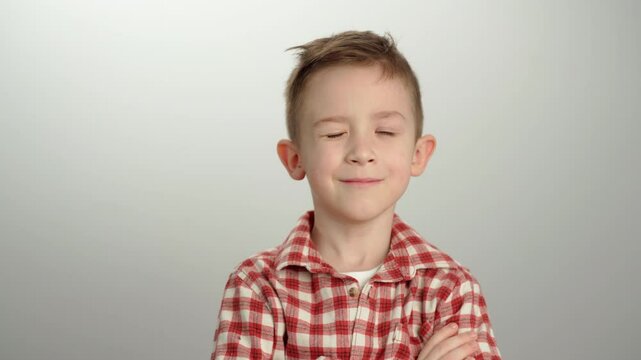 portrait of a child boy with emotions who says yes.