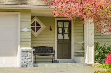 Entrance of luxury house with nice spring blossom landscape at day time in Vancouver, Canada.