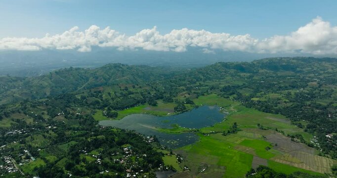 Aerial view of Lake Seloton and farmland under blue sky and clouds. Lake Sebu. Mindanao, Philippines.