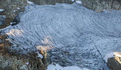 Aerial View of Stunning Glacier with Unique Ice Patterns in the Rugged Mountains of British Columbia, Canada