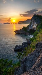 Vibrant sunset setting over rugged rocky coastal landscape image