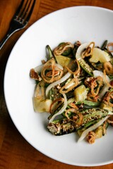 Grilled Okra, Pickled Green Tomatoes, Crispy Shallots, Texas Pecans