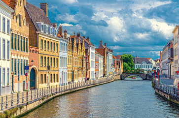 Sint Annarei water canal with Sint-Annarei Bridge, medieval buildings on embankment in Brugge old town quarter in Bruges city historical center, West Flanders province, Flemish Region, Belgium