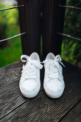 Close-up of bride's sneakers during preparations before the ceremony