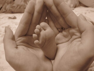 the baby's foot in hands