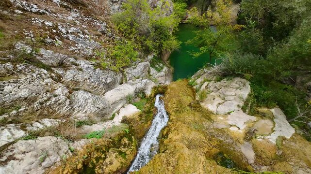 Drone view at Hotnishki Waterfall near Veliko Tarnovo during summer with great acqua colors