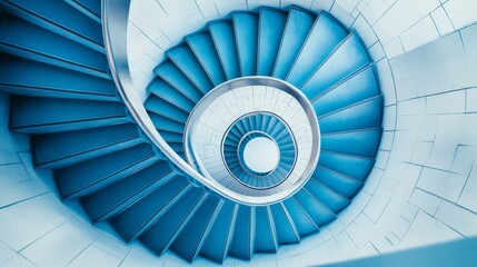 Fototapeta premium The photo shows a spiral staircase from a bird's-eye view. It's a stylish steel staircase that adds a modern touch to any interior.