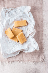 Parmesan or Grana Padana cheese rinds are used in recipes for soups, minestrone and fried in Italy. Eco-friendly food flavoring.  Poor kitchen, zero weste. Rustic style, Italian ingredients, eco style