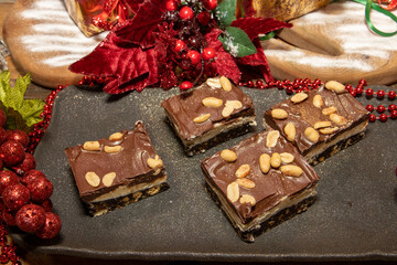 A delicious trey of Salted Peanut Nanaimo Bars which is a dessert that requires no baking and is named after the Canadian city of Nanaimo in British Columbia