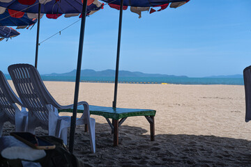 beach chairs and umbrella on the beach