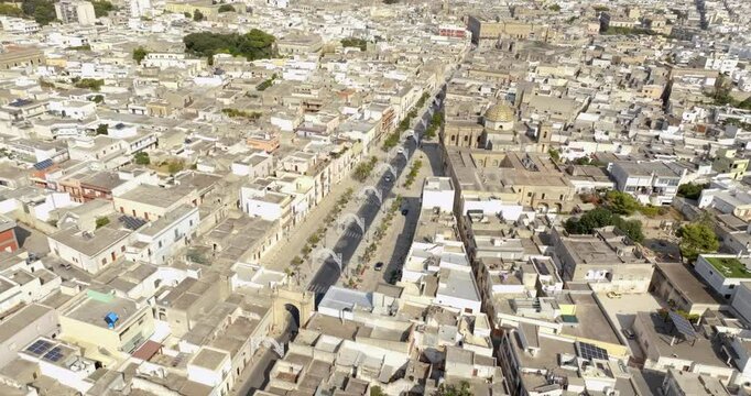 Aerial view of the main street of Manduria, in the province of Taranto, Italy. It is the road that crosses the historic center of the Apulian city.