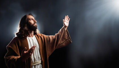 Jesus raises his hands up towards the light © Natalia