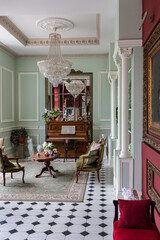 the chic expensive interior of the living room in the historical Baroque style, tiles on the floor, walls decorated with wood. the furniture is in a historical style.
