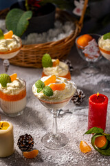 Delicious tangerine panna cotta decorated with mint for christmas dessert