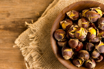 roasted chestnuts in a wood bowl.