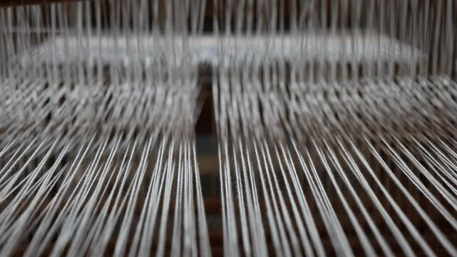 Loom with white strings. Close up.