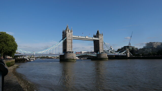 View of Tower Bridge in London, spanning the River Thames. Showcasing the iconic bridge's stunning Gothic architecture and its prominent role in the city's skyline