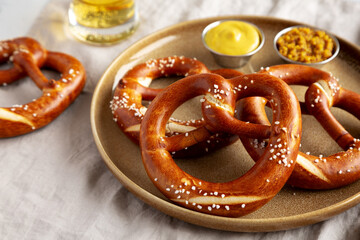 Homemade Bavarian-Style Soft Pretzels with Salt and Beer, side view.