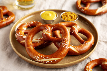 Homemade Bavarian-Style Soft Pretzels with Salt and Beer, side view.
