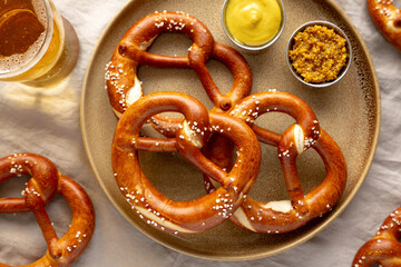 Homemade Bavarian-Style Soft Pretzels with Salt and Beer, top view.