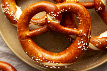 Homemade Bavarian-Style Soft Pretzels with Salt and Beer, top view.