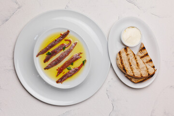 Beautiful presentation of anchovies in oil. Food photography.