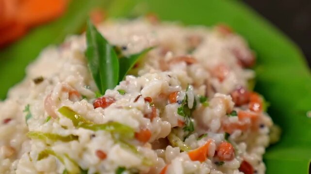 South Indian curd rice combines creamy yogurt with fluffy rice, offering a tangy, refreshing taste. A staple in South Indian cuisine, this dish is loved for its light and soothing qualities.