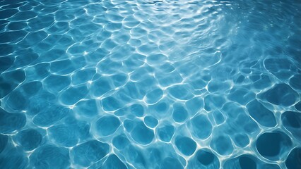 Obraz premium Close-up of a swimming pool's water surface from above, showcasing sunlight reflections creating intricate patterns, perfect for backgrounds or texture designs.