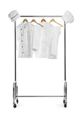 Different chef's uniforms on clothing rack against white background