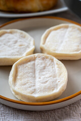 Rocamadour or cabecous soft goat AOC cheese with soft rind produced on farm in Perigord and Quercy on farmers market, departement Lot, France