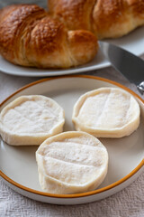 Rocamadour or cabecous soft goat AOC cheese with soft rind produced on farm in Perigord and Quercy on farmers market, departement Lot, France