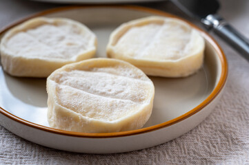 Rocamadour or cabecous soft goat AOC cheese with soft rind produced on farm in Perigord and Quercy on farmers market, departement Lot, France