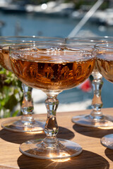 Summer party, French brut rose champagne sparkling wine in coupe glasses in yacht harbour of Port Grimaud near Saint-Tropez, French Riviera vacation, Var, France
